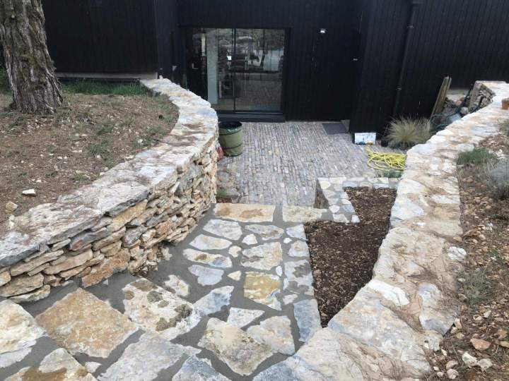 Enhance your gardens with durable masonry features.